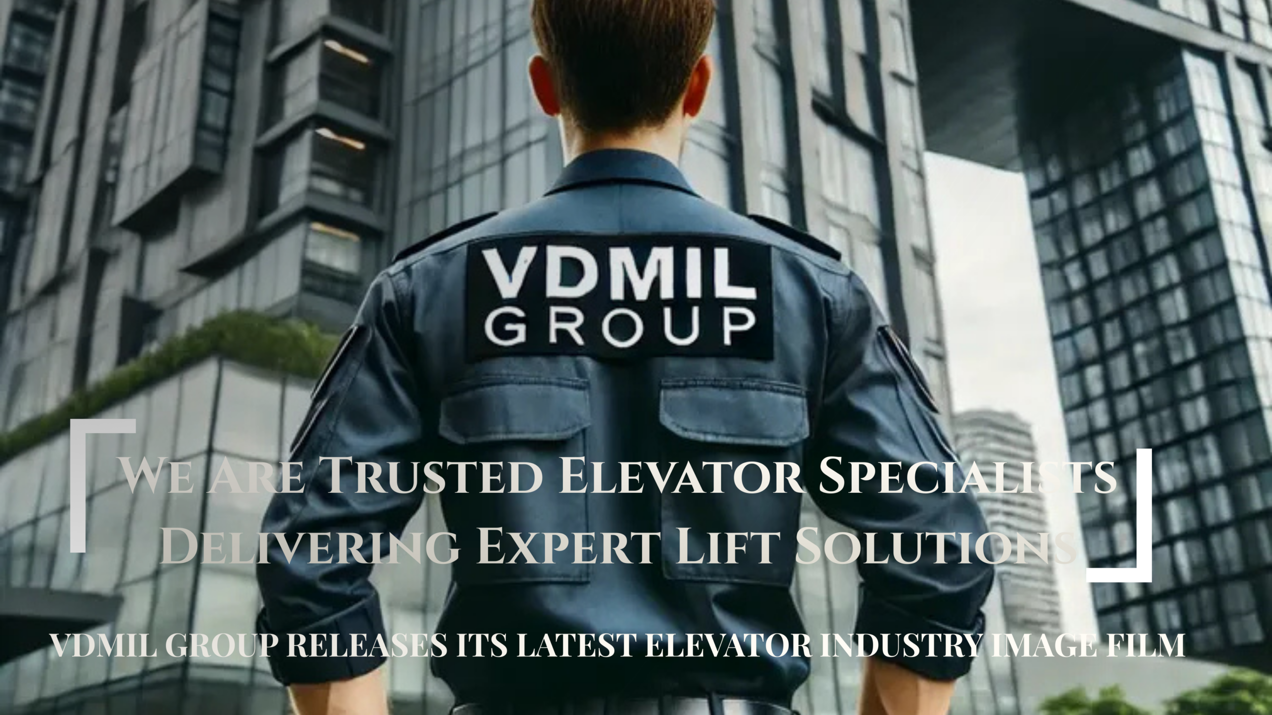 A VDMIL Group specialist standing in front of modern high-rise buildings, representing the company’s expertise in delivering trusted elevator and lift solutions.
